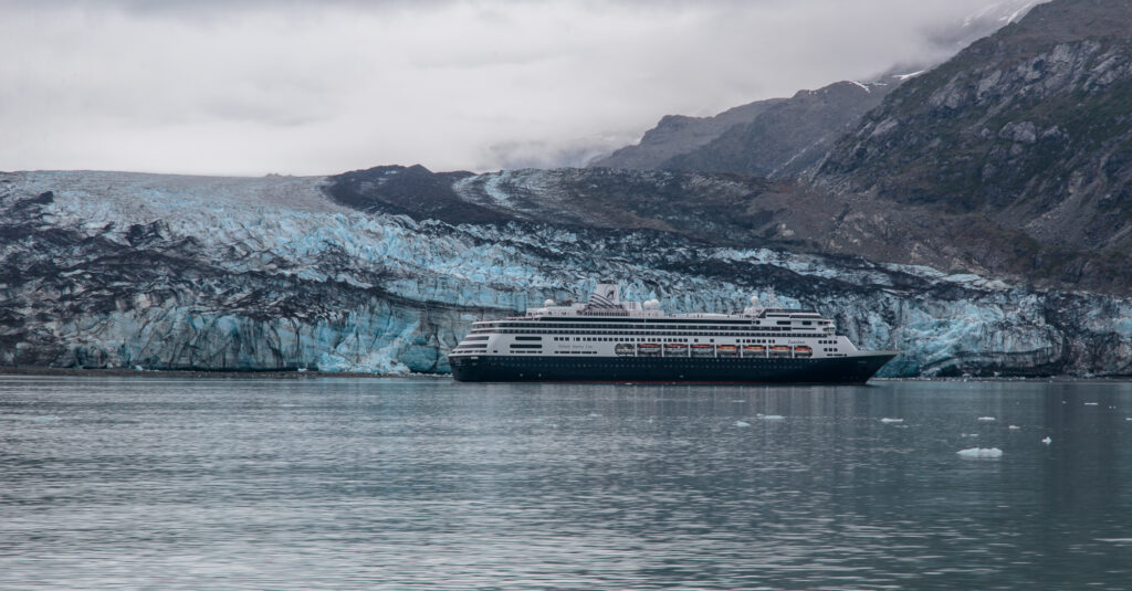A cruise ship in front of Lamplugh Glacier