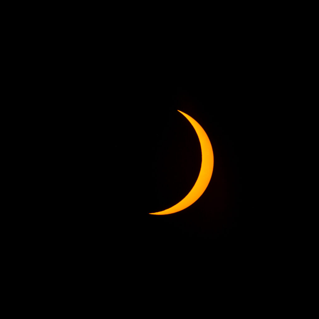 Crescent sun after totality