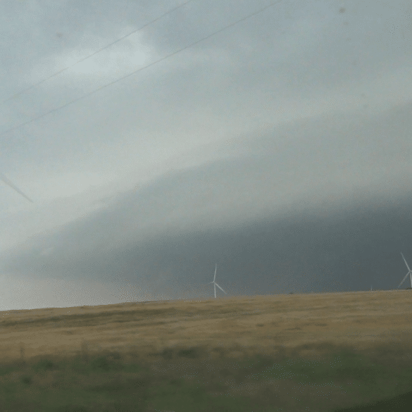 Lots of energy coming out of the El Reno supercell. Video capture from the south looking across wind farm near Union City