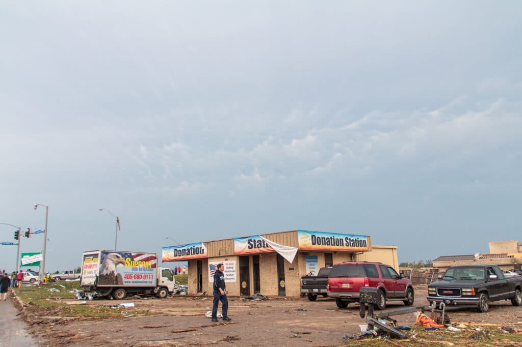 Mammatus in the background of a damaged donation station at I-35 and 4th street