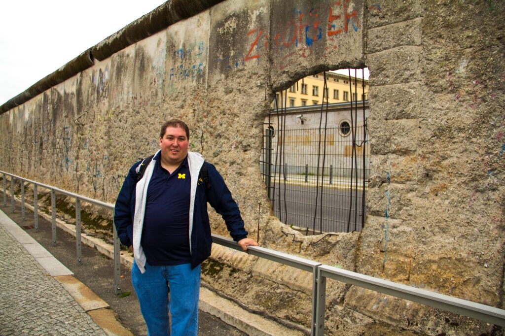 Me in front of the Berlin Wall