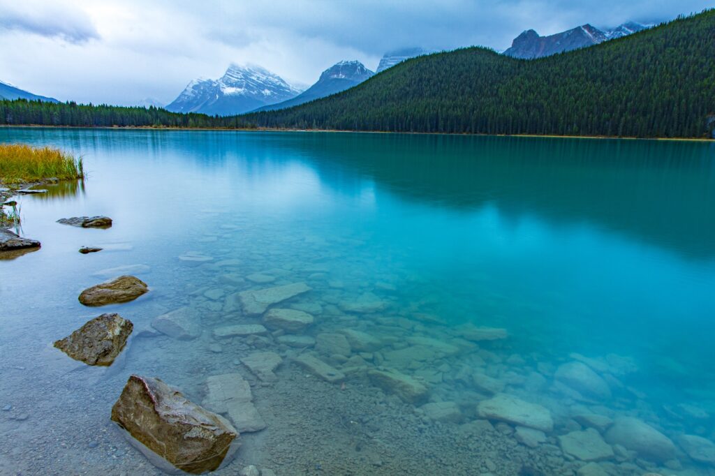 Reflection of the mountains off Waterfowl Lakes in Banff National Park Canada