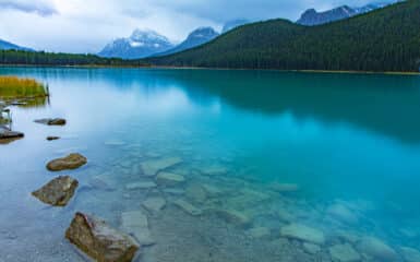 Reflection of the mountains off Waterfowl Lakes in Banff National Park Canada