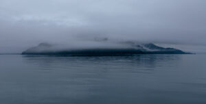 A misty Marble Island in Glacier Bay National Park in Alaska