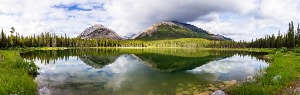 Reflecting off a pond in Spray Lakes Provincal Park