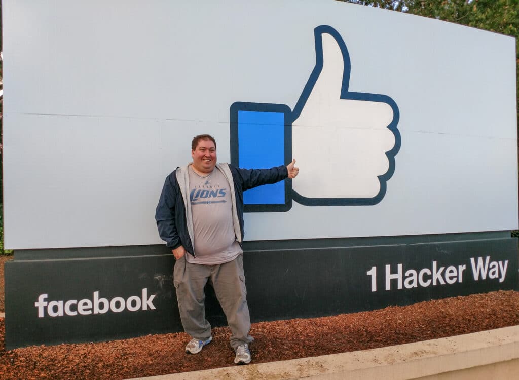 Me in front of the Facebook sign