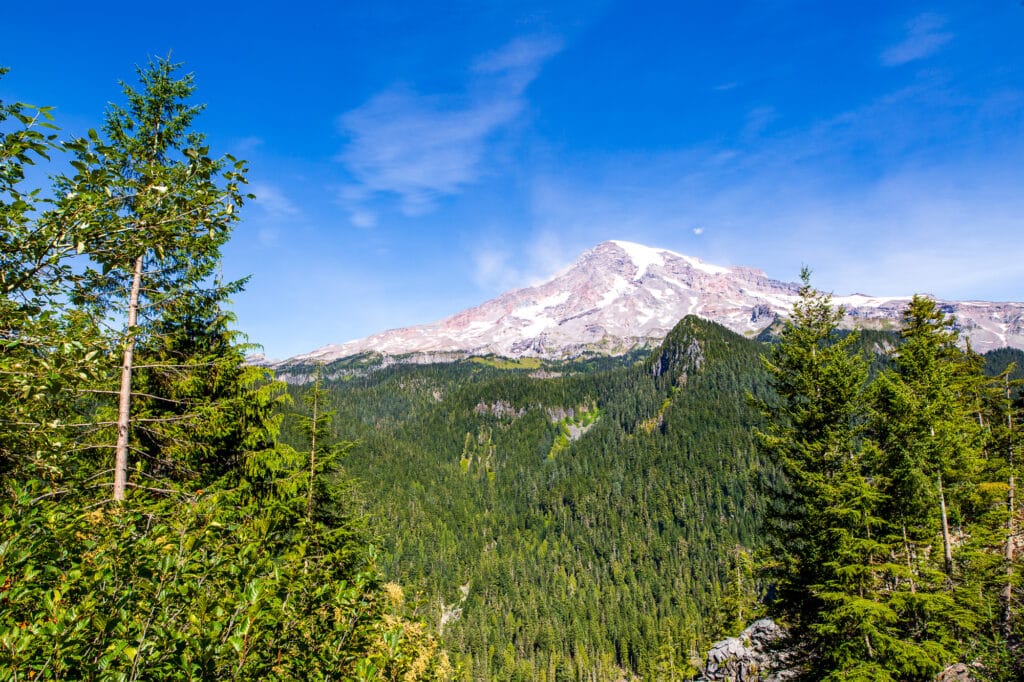 Mount Rainier on a clear day in September 2020. There is some smoke visible coming off the left side of the mountain.
