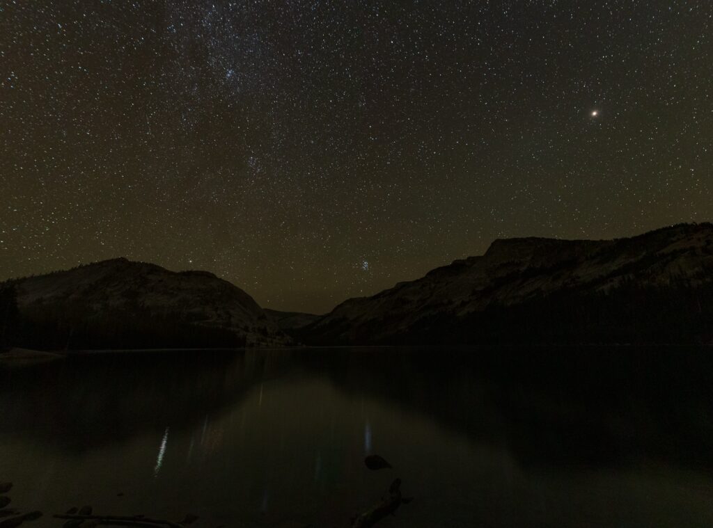 Night sky reflects off Tenaya Lake in Yosemite