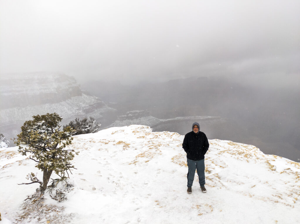 Bill at Grand Canyon, unable to see because of how much it was snowing
