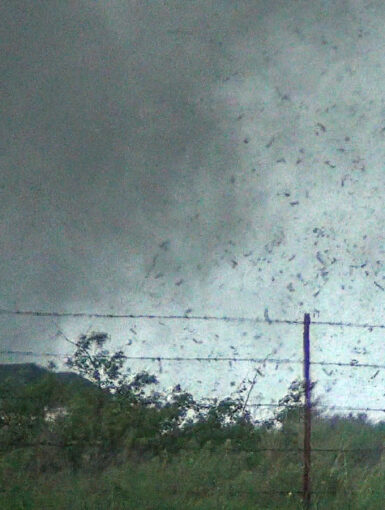 Debris in the air as the tornado approaches Sooner Rd. Video Still