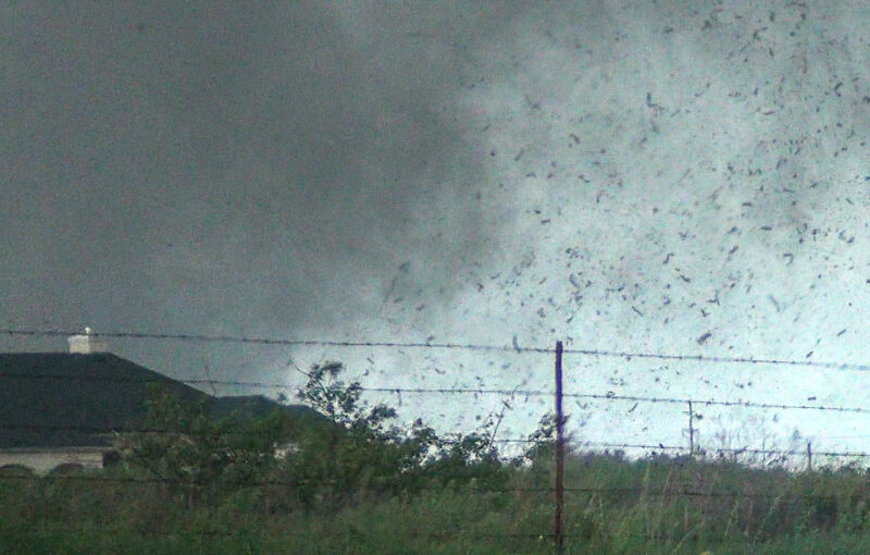 Debris in the air as the tornado approaches Sooner Rd. Video Still