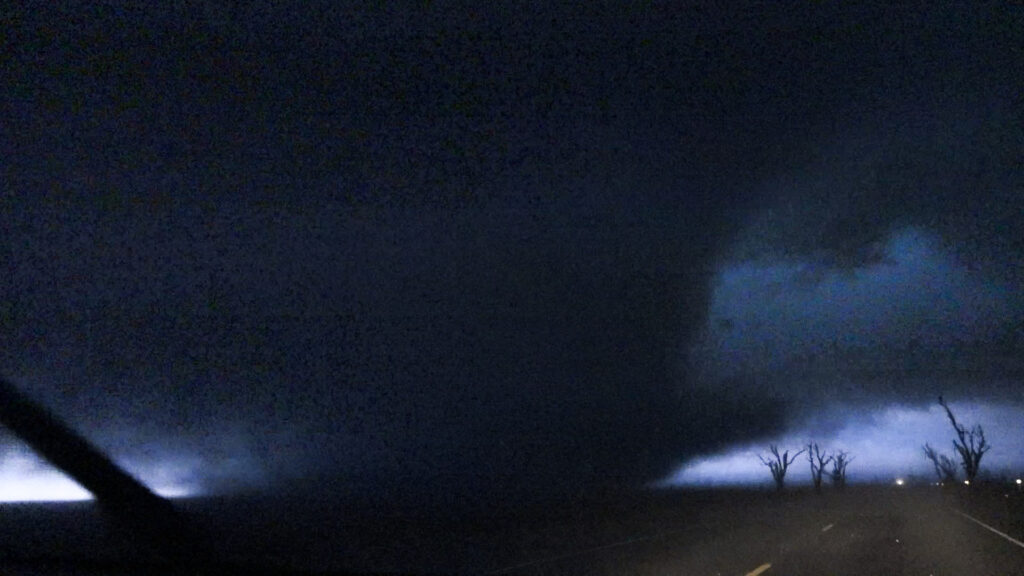 Tornado crosses US60 northeast of Pampa, TX after dark on November 16, 2015. This was on the first wedge producing storm of the night. This is a video still